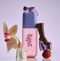 Pink and purple bottle with 'Bratz' branding, surrounded by a strawberry, high-heeled shoes, and sunglasses on a light purple background.